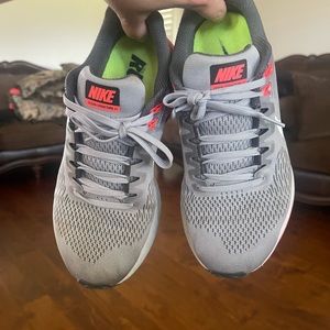 Pink and grey Nike running shoes